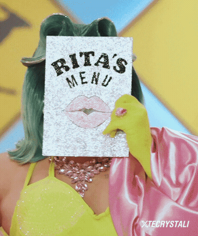 Rita 'S Menu Is Being Held Up By A Woman GIF