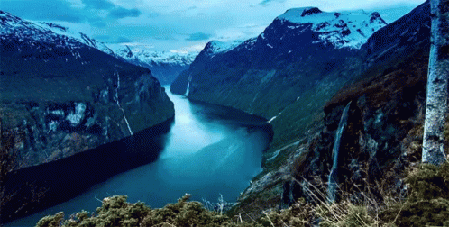 River Flowing Through Mountain Valley GIF