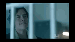 Riverdale Jughead Talking Behind Railings GIF