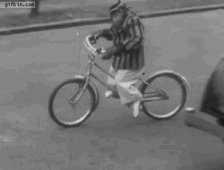 Rizz Vintage Monkey Riding Bike GIF