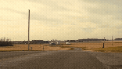 Road Through Field With Telephone Pole GIF
