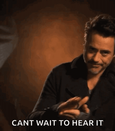 Robert Downey Jr. Holding Cell Phone Saying Cant Wait To Hear It GIF