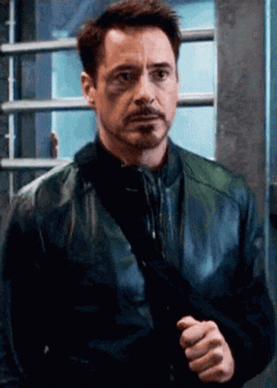 Robert Downey Jr. Holding Gun In Black Leather Jacket GIF