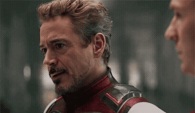 Robert Downey Jr. Talking To Man In Red And White Suit GIF