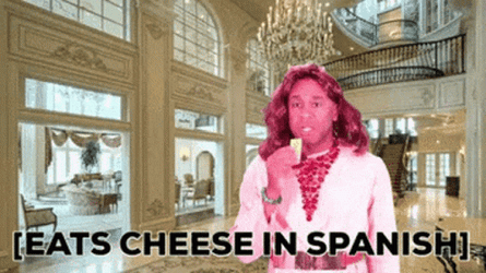 Robert E Blackmon Eats Cheese In Spanish GIF
