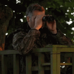 Robert Fuller Watching Thru Binoculars GIF