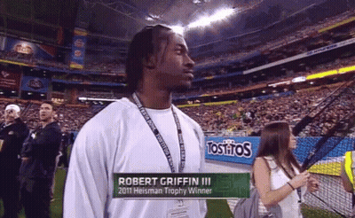 Robert Griffin III 2011 Heisman Winner In Front Of Tostitos Sign GIF