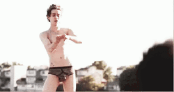 Robert Sheehan Putting Lotion On Thigh GIF