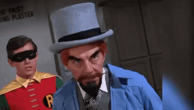 Robin And Penguin Standing Together Penguin In Top Hat And Tie GIF