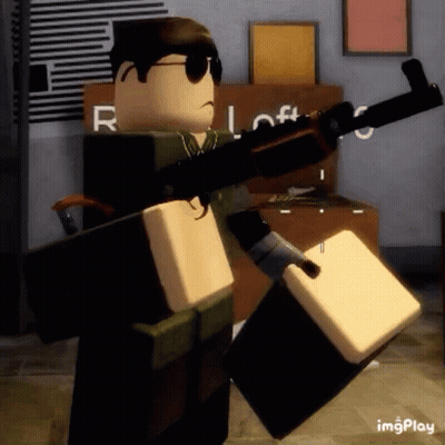 Roblox Character Holding Gun And Box In Room GIF