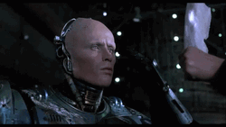 Robocop Looking At Mirror GIF