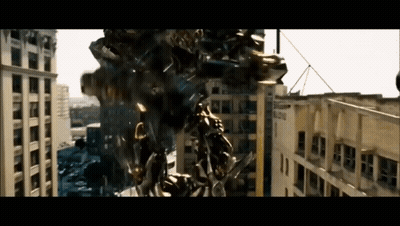Robot Flying In Front Of City Building GIF
