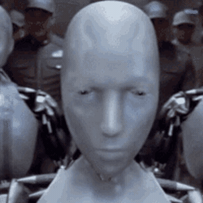 Robot Head Close Up In Front Of Crowd GIF
