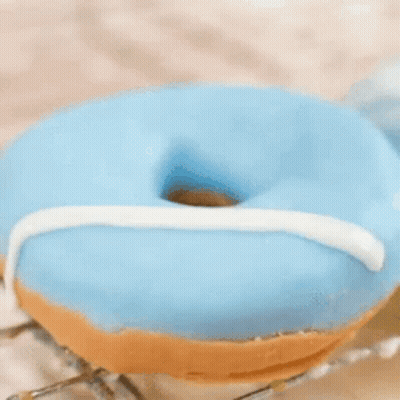 Robot Holding Donut With Donuts Sign GIF