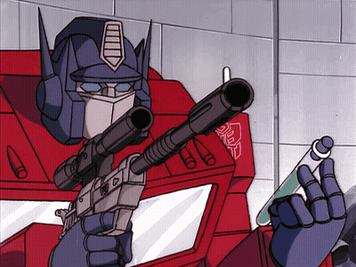 Robot Holding Gun With Transformers Chest GIF
