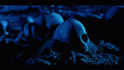 Robot Holding Machine Gun On Dark Blue GIF