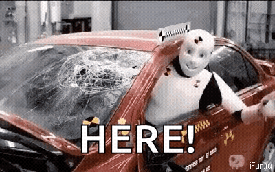 Robot In Car With Broken Windshield Saying Here GIF