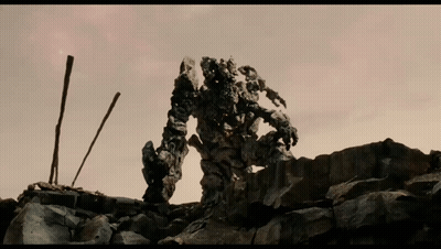 Robot On Pile Of Rocks GIF