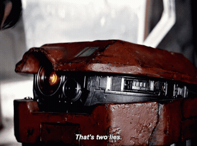 Robot Says That's Two Lies In Front Of Another Robot GIF