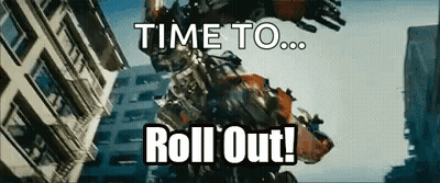 Robot Says Time To Roll Out In Front Of Building GIF