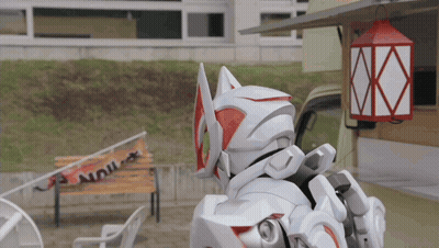 Robot Standing Before Building With Red Lantern GIF