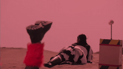 Robot Standing Before Red Lantern Building GIF