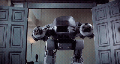 Robot Standing In Front Of Door GIF