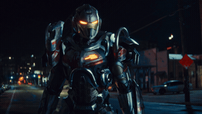 Robot Standing In Front Of Red And White Stop Sign GIF