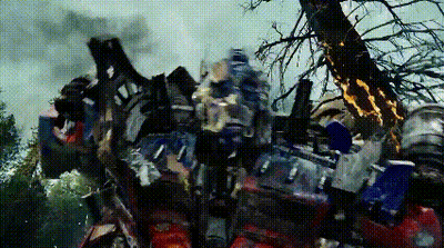Robot Standing Next To Smoking Tree GIF
