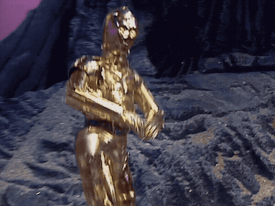 Robot Statue Covered In Gold Powder Purple Background GIF