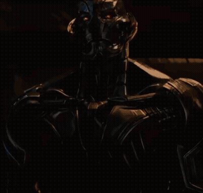 Robot Statue In Busy City Street GIF