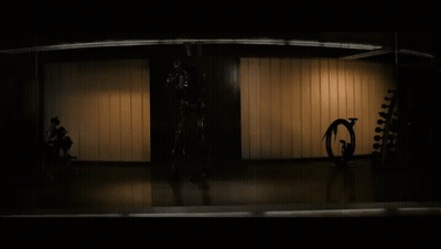 Robot Statue In Busy City Street GIF