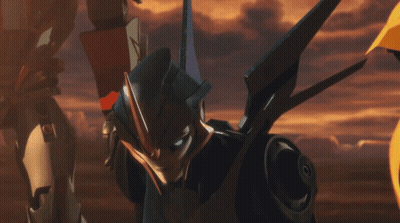 Robot With Blue Eyes In Front Of Yellow Robot GIF