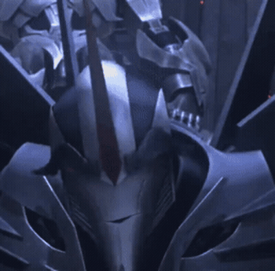 Robot With Red Eyes Looking At Camera GIF