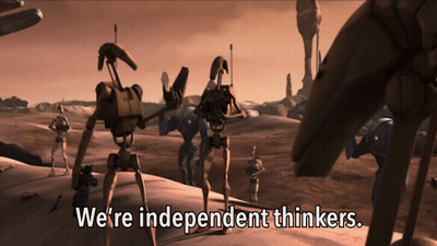 Robots Standing In Desert With We Are Independent Thinkers GIF