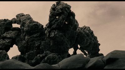 Rock Monster Statue On Rocky Hillside GIF