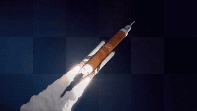 Rocket Flying In Dark Blue Sky GIF