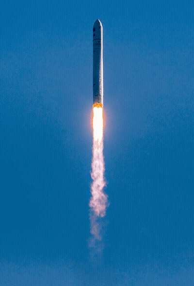 Rocket Flying Through Blue Sky GIF