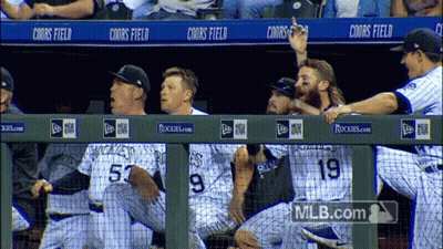 Rockies Baseball Players Sitting On Dugout GIF