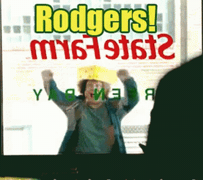 Rodgers Sign With Woman In Yellow Hat GIF
