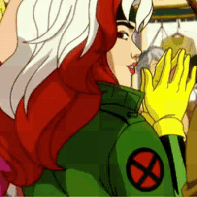 Rogue From The X-Men Is Wearing A Green Jacket With A Red X On It And Yellow Gloves . GIF