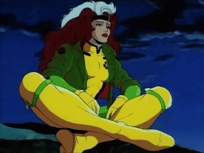 Rogue From The X-Men Sits On A Rock With Her Legs Crossed GIF