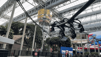 Roller Coaster In Building With Red Exit Sign GIF