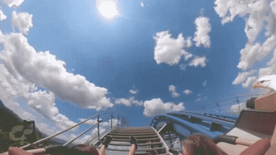 Roller Coaster With Blue Sky And White Clouds GIF