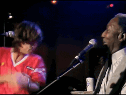 Rolling Stones Mick Jagger Drinking On Stage GIF