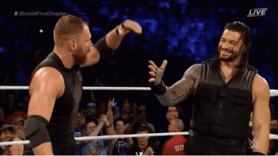 Roman Reigns Hugging Man In Wrestling Ring GIF