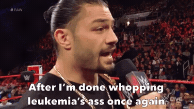 Roman Reigns Is Talking Into A Microphone During A Wrestling Match GIF
