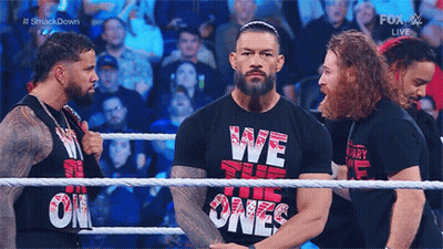 Roman Reigns Is Wearing A Black Shirt That Says We The Ones On It . GIF