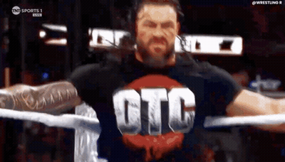 Roman Reigns Is Wearing A T-Shirt With The Word Gtc On It . GIF