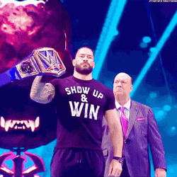 Roman Reigns Raises Belt GIF